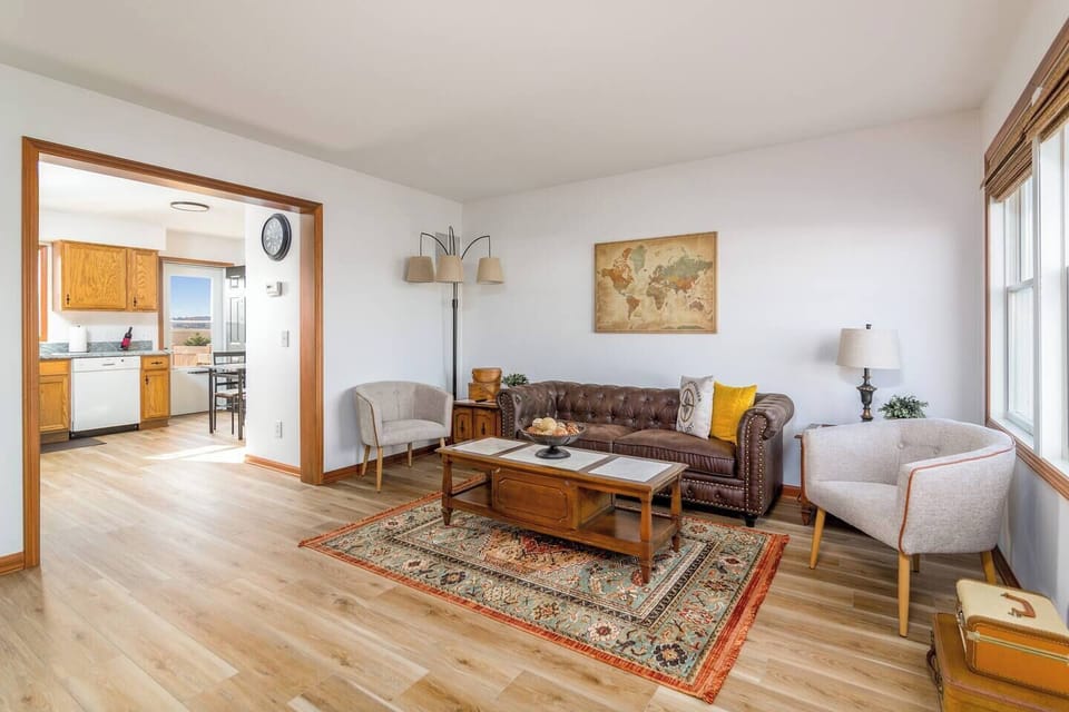 Second living area w/ seating, rug accents & bright window light