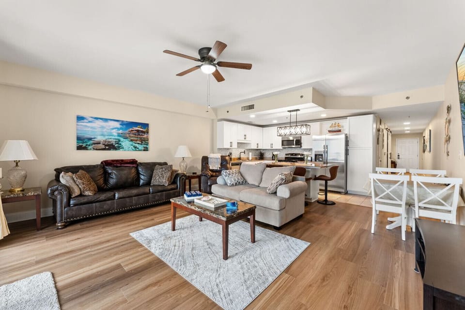 Spacious open-concept living area offers plenty of seating and flows seamlessly into the updated kitchen