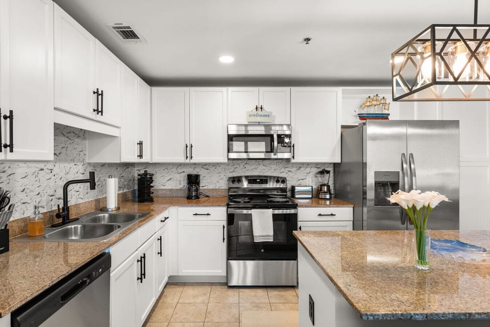 Fully equipped kitchen includes stainless steel appliances and plenty of counter space for cooking