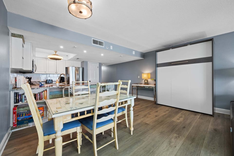 Dining area and a queen murphy bed