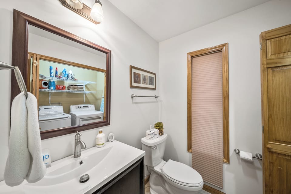 A clean, well-stocked bath at Blowing Rock Retreat, with the convenience of an in-unit washer and dryer just steps away.