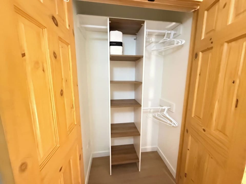 Compact yet efficient — the built-in closet organizer offers ample hanging space and shelving, serving as a smart dresser alternative.