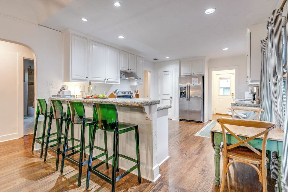 Spacious kitchen island with seating for four and stylish modern touches