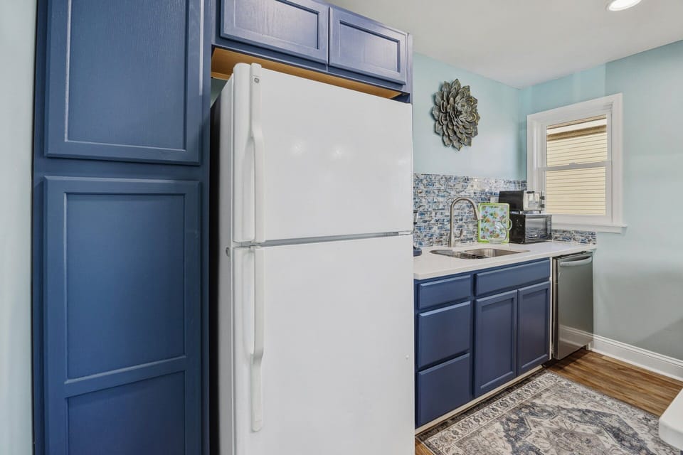 The well-equipped kitchen provides everything needed to prepare meals and beach-day snacks.