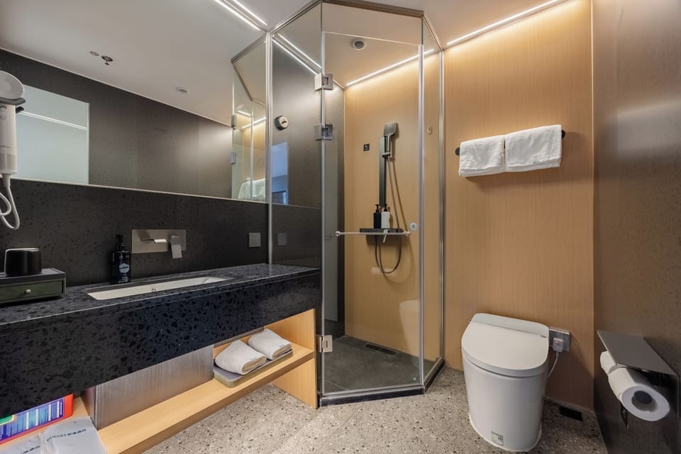 Superior Double Room, Courtyard View | Bathroom | Shower, hair dryer, slippers, towels