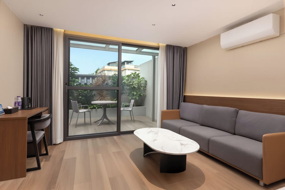 Family Twin Room, Courtyard View, Courtyard Area | Desk, laptop workspace, blackout drapes, soundproofing