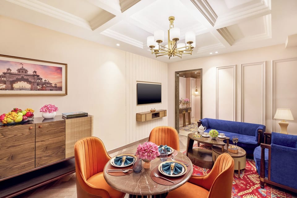 Luxury Suite | Living area | 54-inch Smart TV with digital channels, books