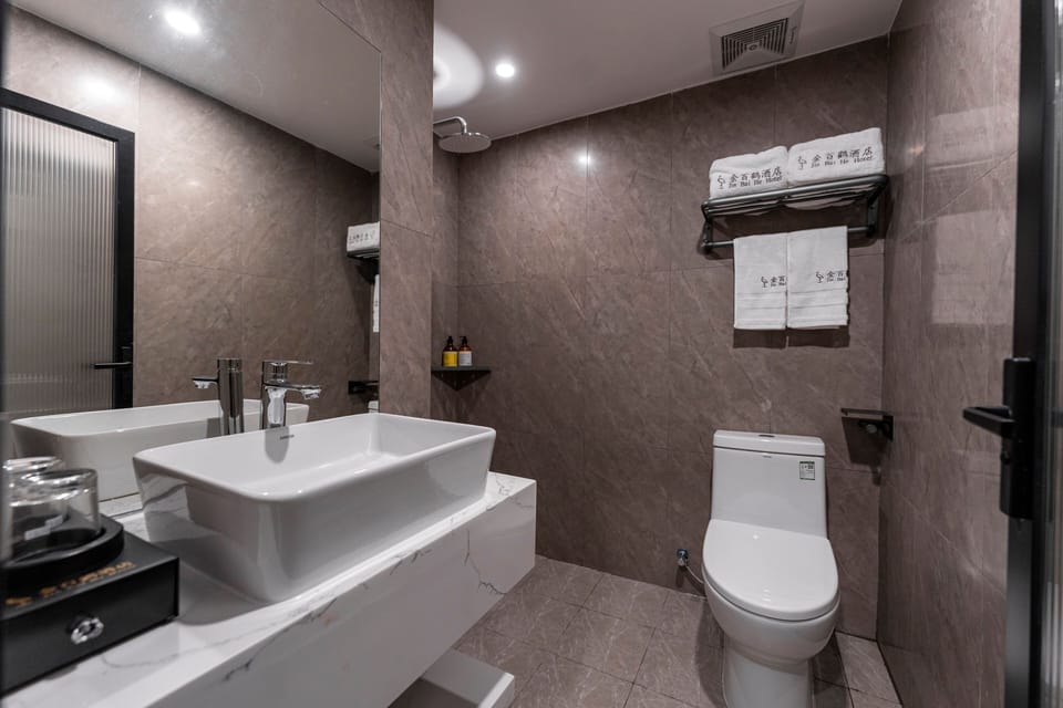 Shower, hair dryer, slippers, towels