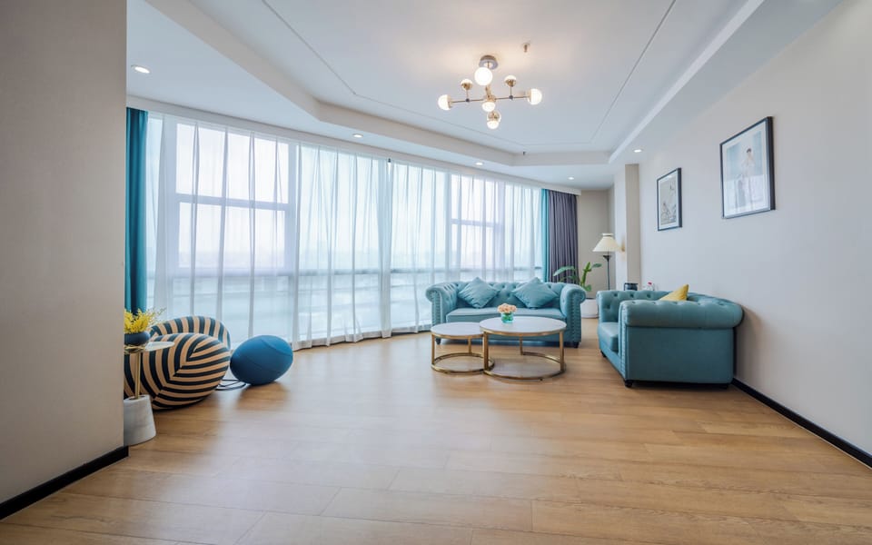 Superior Suite, City View | Living area | 55-inch LED TV with cable channels, first-run movies, pay movies
