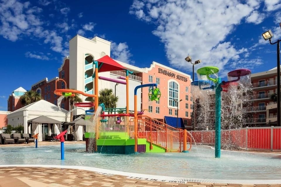 Cool off under fountains while kids laugh and explore.