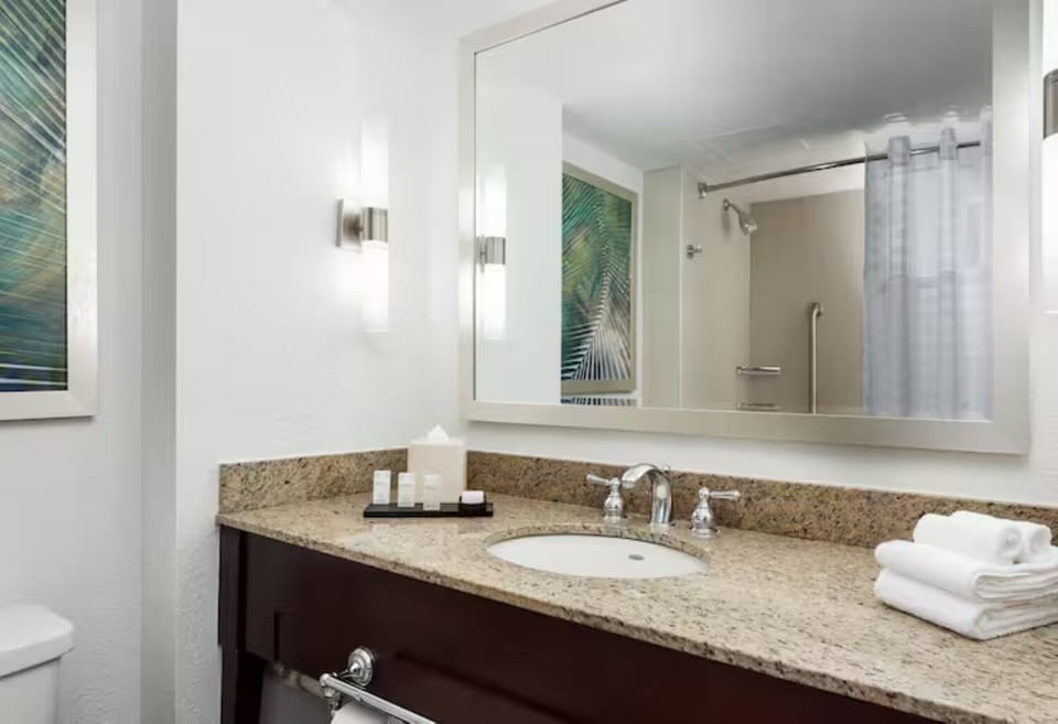 Refresh at the granite vanity with fluffy towels ready.