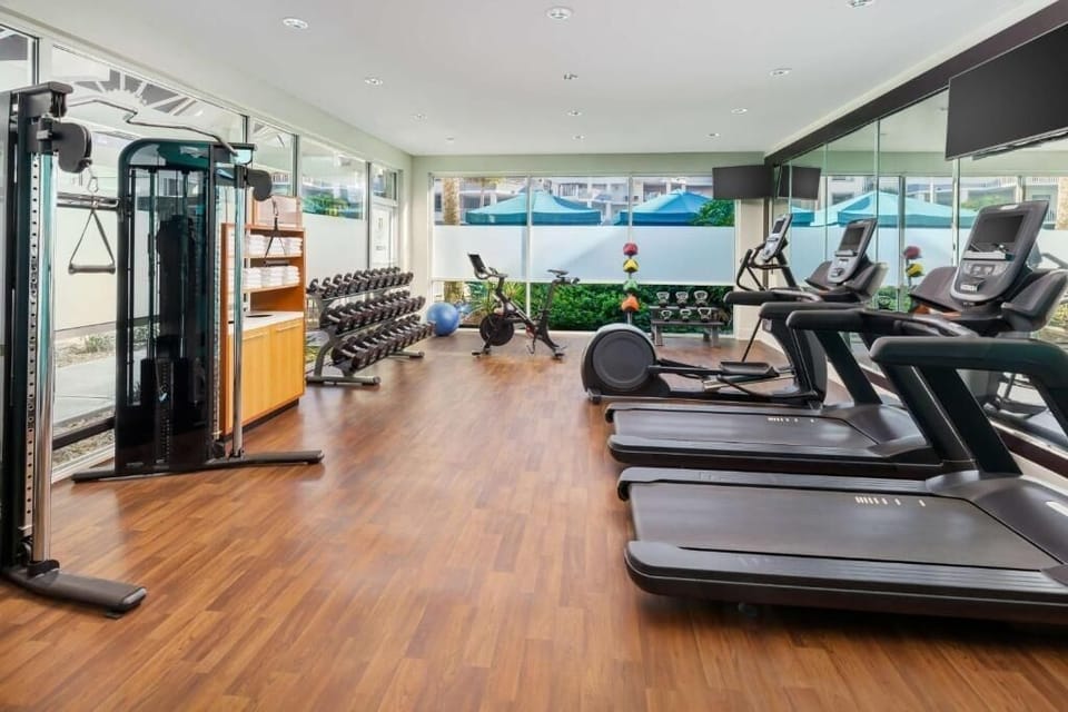 Power through workouts in the bright, fully equipped fitness room.