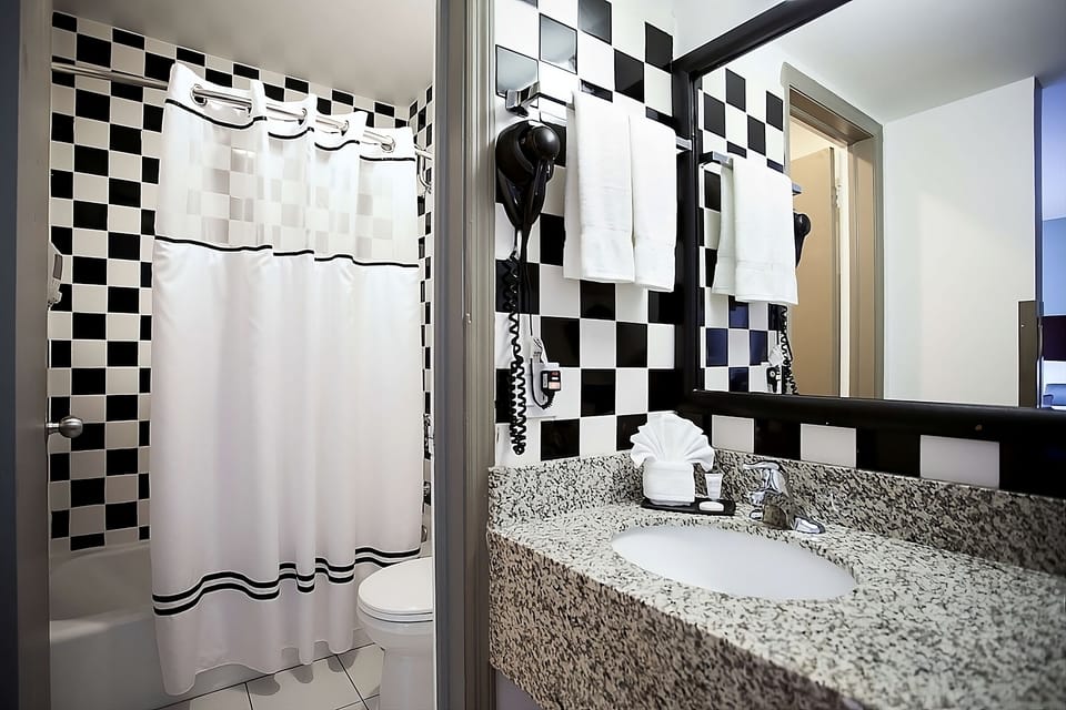 Refresh easily with bright vanity lighting and fluffy clean towels.