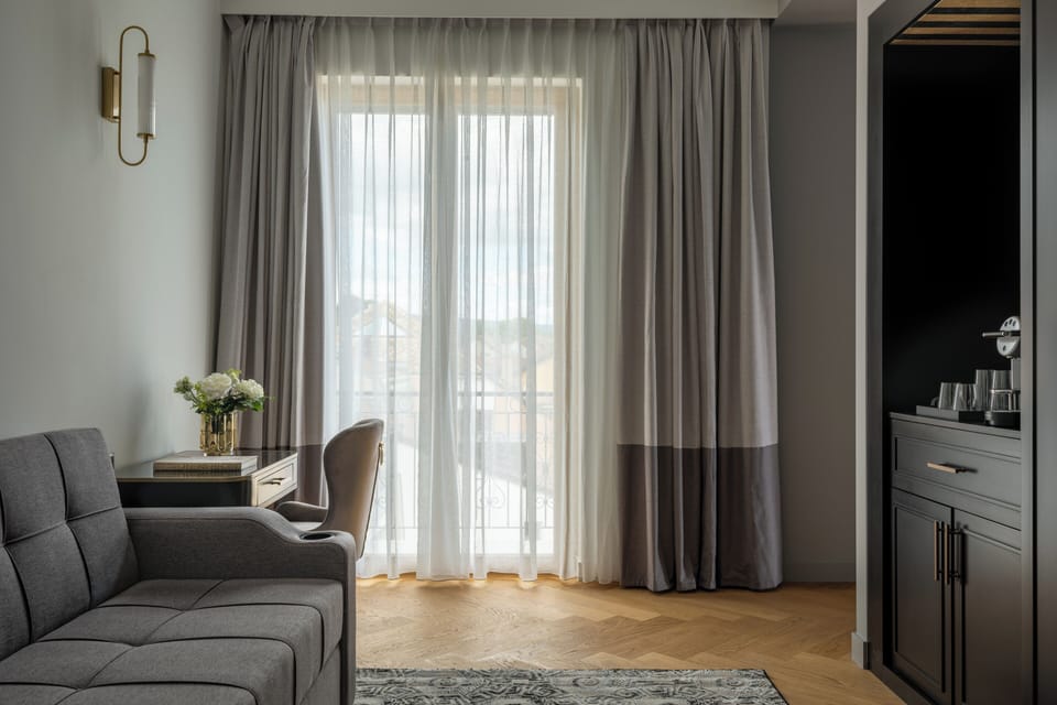 Luxury Suite, Balcony, Lake View | Living area | 100-cm flat-screen TV with satellite channels, offices
