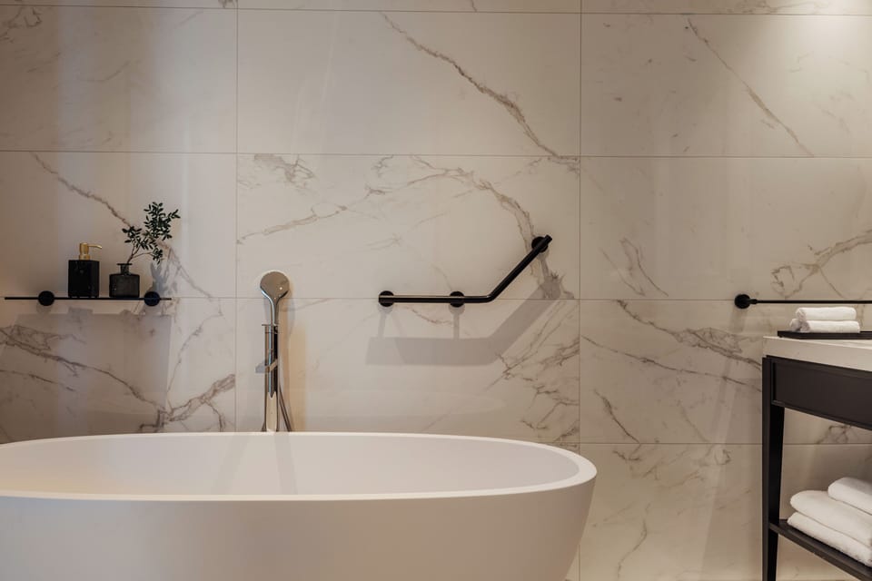 Luxury Suite, Balcony, Lake View | Bathroom | Hair dryer, towels, soap, shampoo