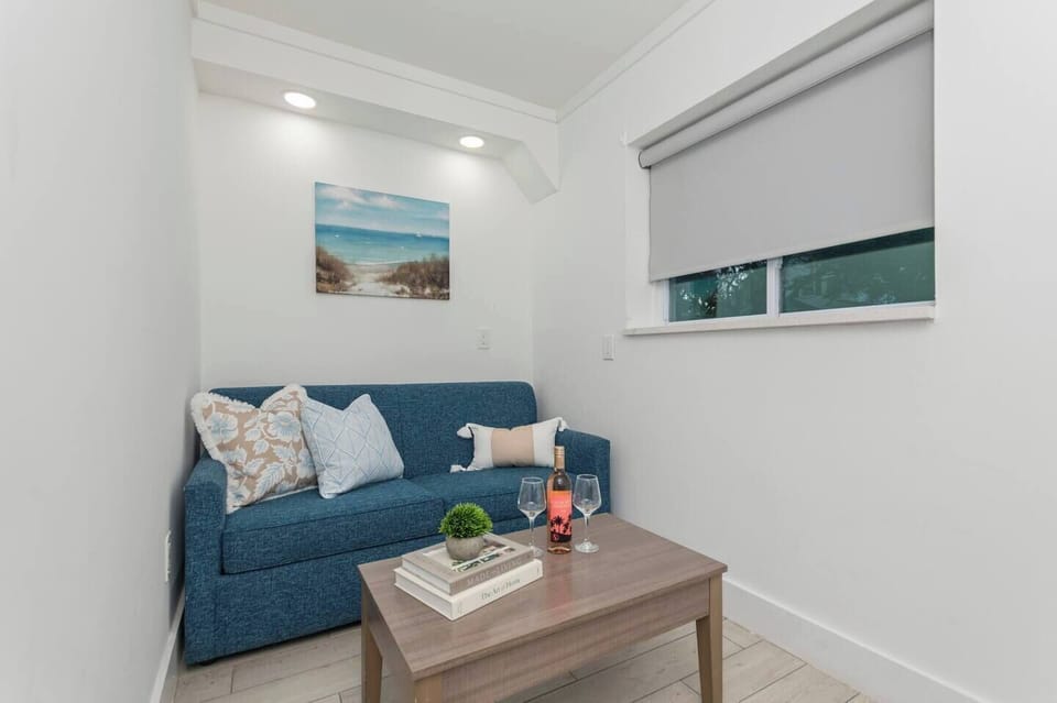 Bright, cozy living area with a sleeper sofa that easily pulls out into a bed.