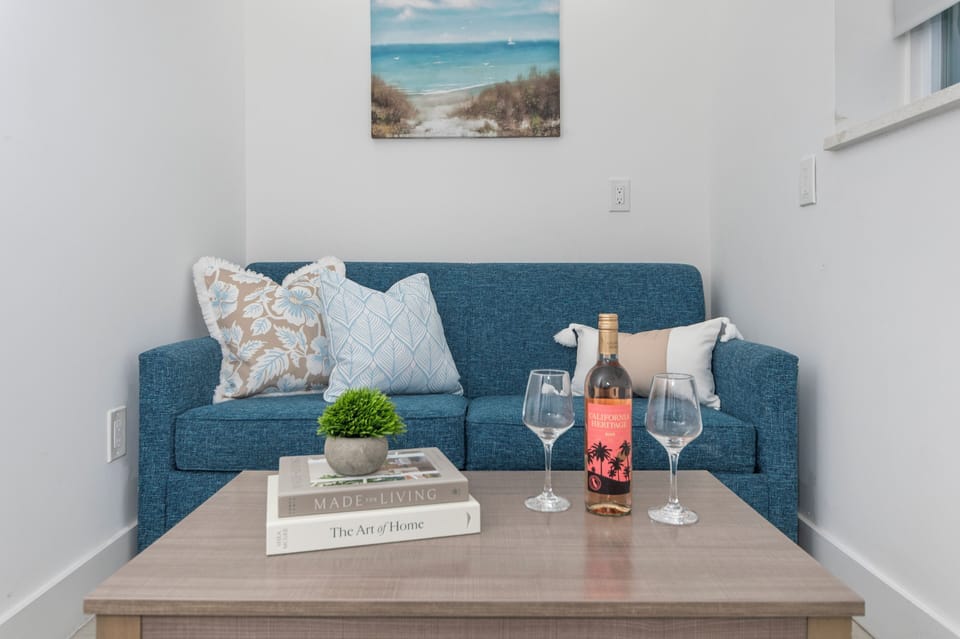 Bright, cozy living area with a sleeper sofa that easily pulls out into a bed.