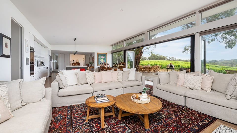 Living space with plenty of seating around the fireplace 