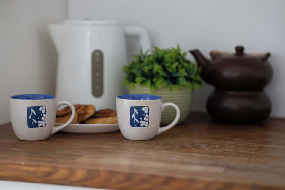 Kitchen detail with cups and decor.