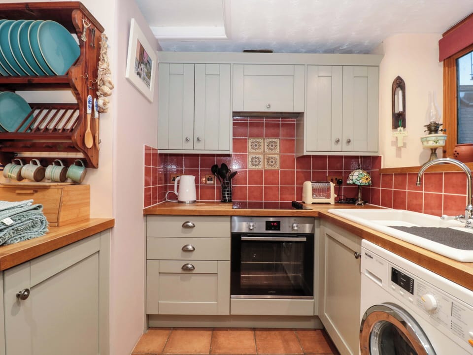 Fridge, microwave, cookware/dishes/utensils