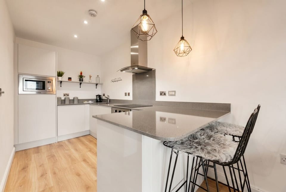 Gather at the island breakfast bar in this bright, modern kitchen.