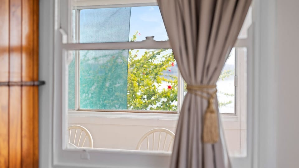 Sunlit interior with soft curtains and a calm, airy ambiance