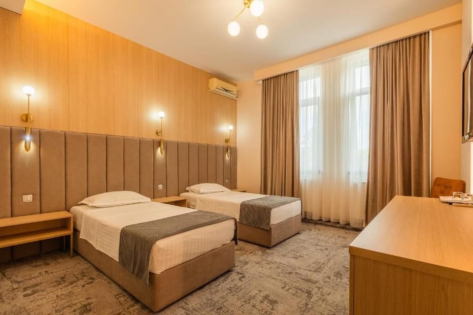 Double or Twin Room | Blackout drapes, iron/ironing board, free WiFi