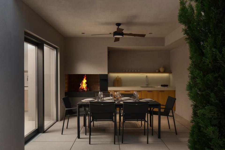 Covered terrace with a summer kitchen and dining area, perfect for group entertaining and al fresco meals.