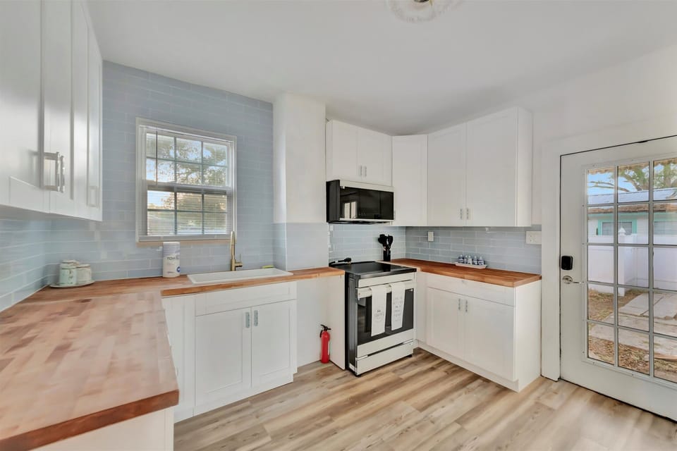 Full kitchen with butcher block countertops