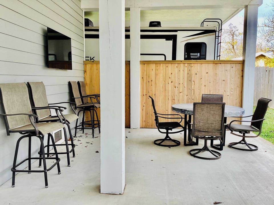 Downstairs patio with smart TV and plenty of seating for everyone