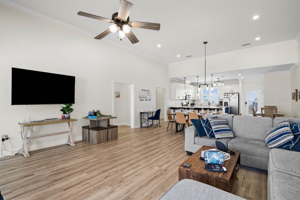 Relax in your bright, open-concept living space with comfortable seating, modern amenities, and a fully equipped kitchen perfect for gatherings.