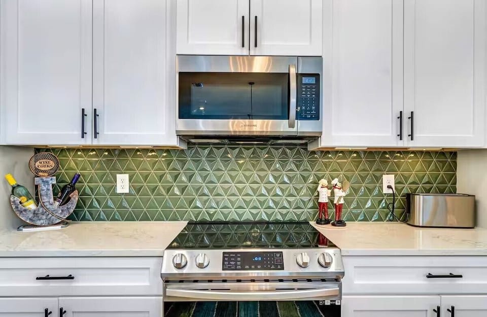 Cook, gather, and entertain with ease in the fully stocked kitchen, complete with all major appliances and everything you need for effortless coastal dining.