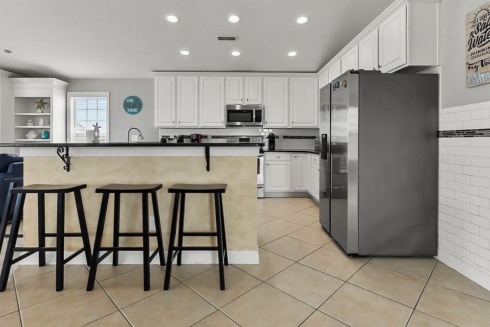 Large kitchen with barstool seating, large counter space, and all necessary amenities!