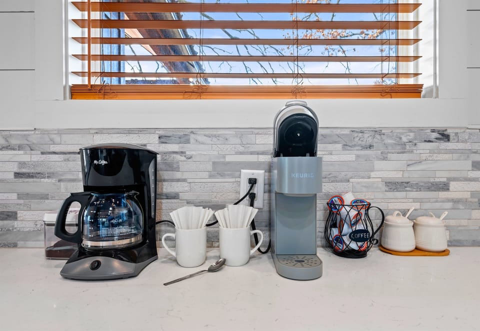 Starting the day is easy with this coffee and drink station, giving you a convenient spot to grab your favorite morning pick-me-up.
