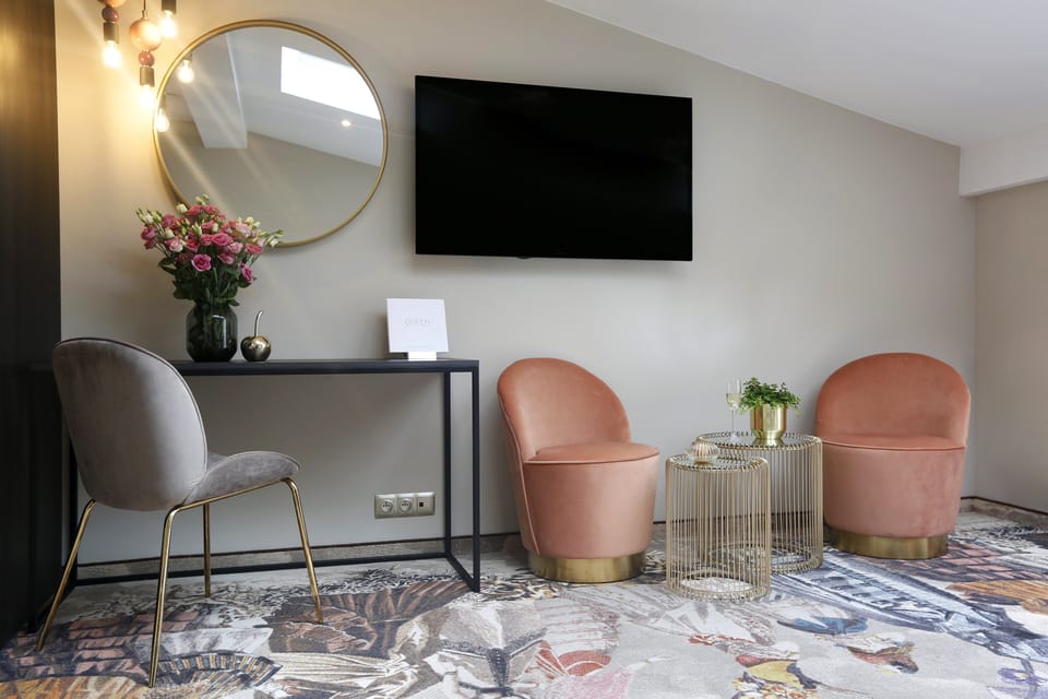 Sip wine and chat in chic velvet chairs after sightseeing.