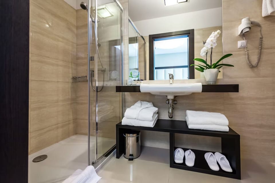 Unwind after adventures in a bright shower-and-vanity retreat.