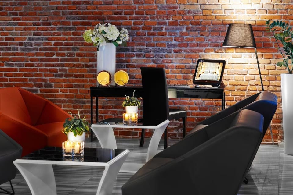Unwind with candlelit ambiance and a chic reading corner.