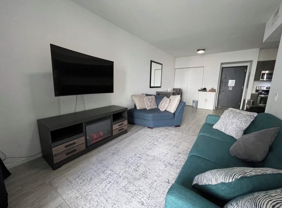 Living Room with TV & Balcony 