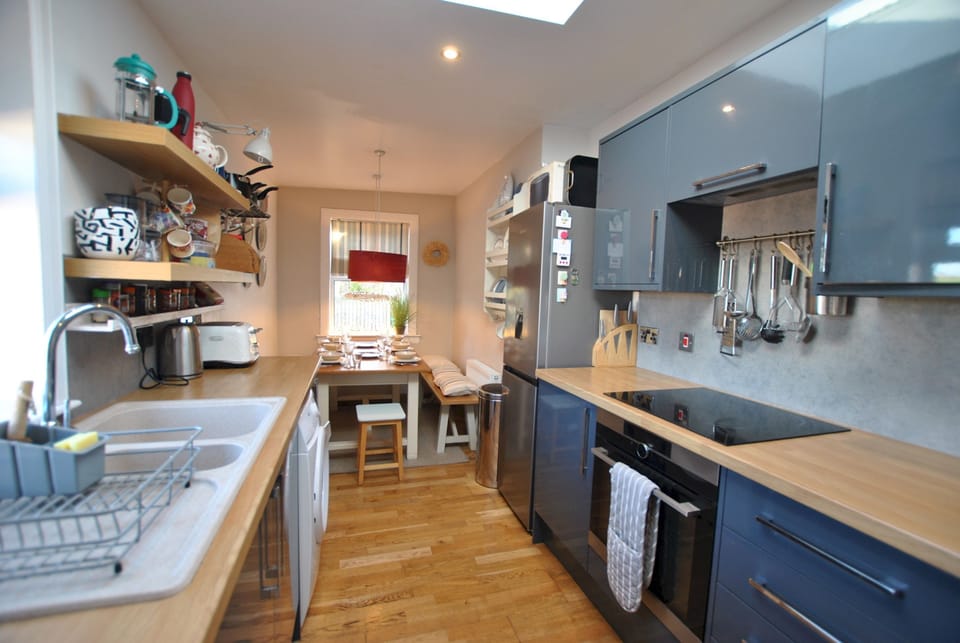 The galley style kitchen is well equipped