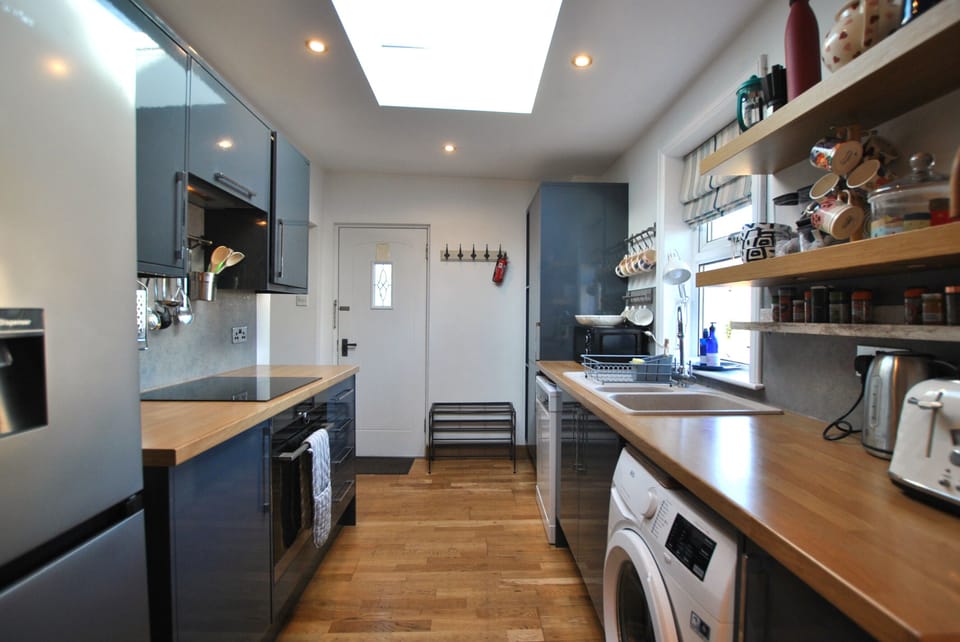 The main entrance opens into the kitchen