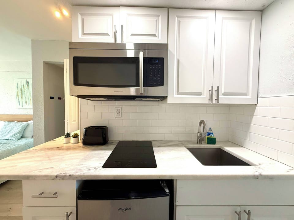 Fully equipped kitchen with essential appliances, perfect for home-cooked meals