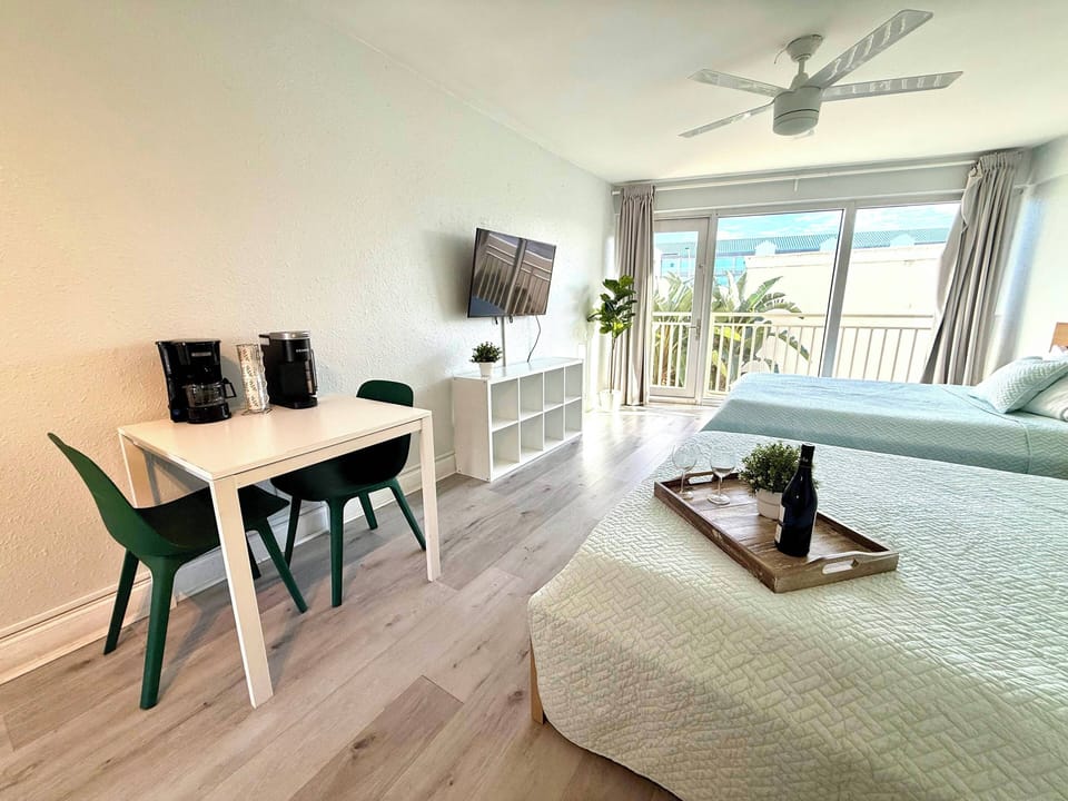 Bright and modern living area with dining space, perfect to unwind after a beach day