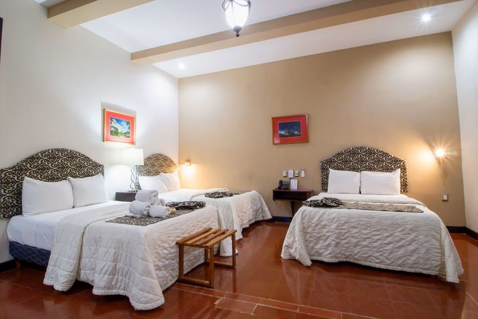Unwind in a spacious room with crisp linens and calm lighting