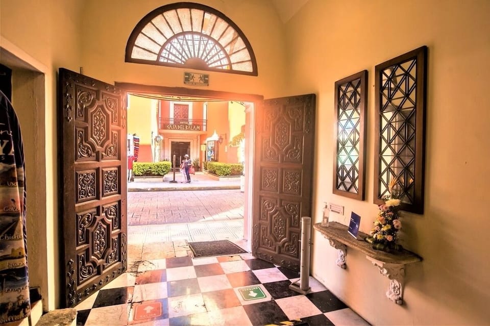 Admire the grand atrium canopy filtering warm, golden daylight.