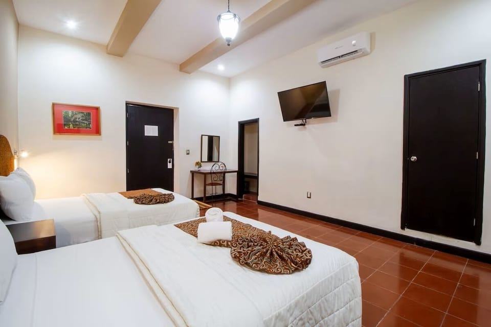 Kick back with in-room TV, A/C, and restful beds.