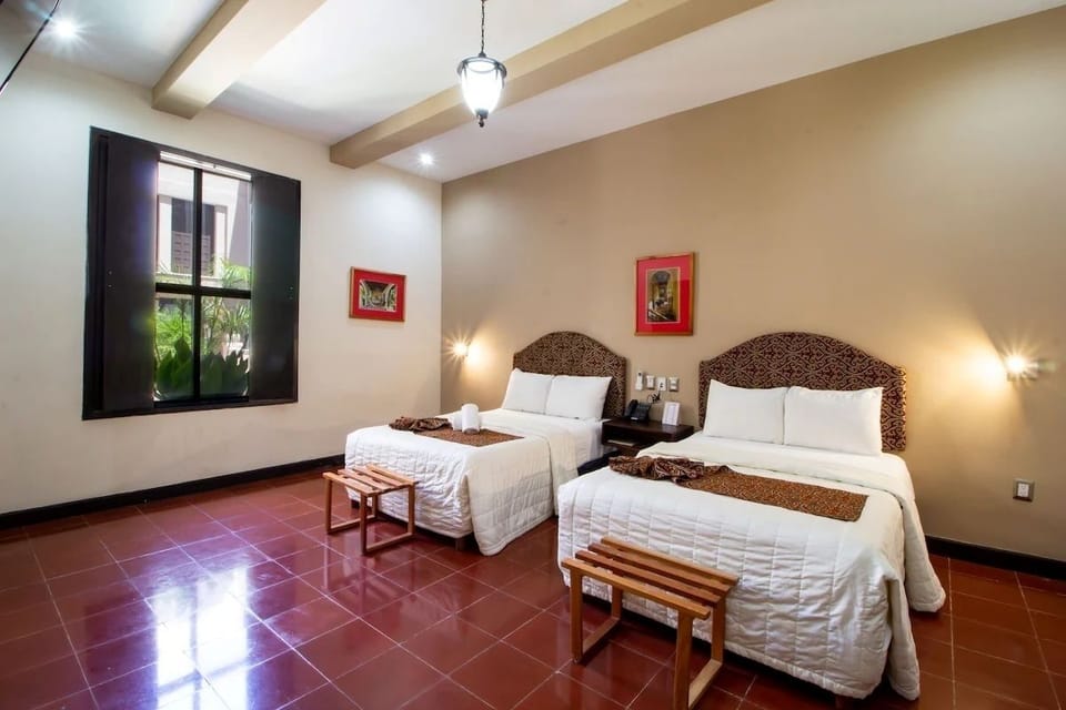 Settle in under soft lighting with two inviting beds.