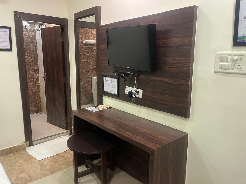 Classic Double Room, City View | Desk, laptop workspace, soundproofing, iron/ironing board