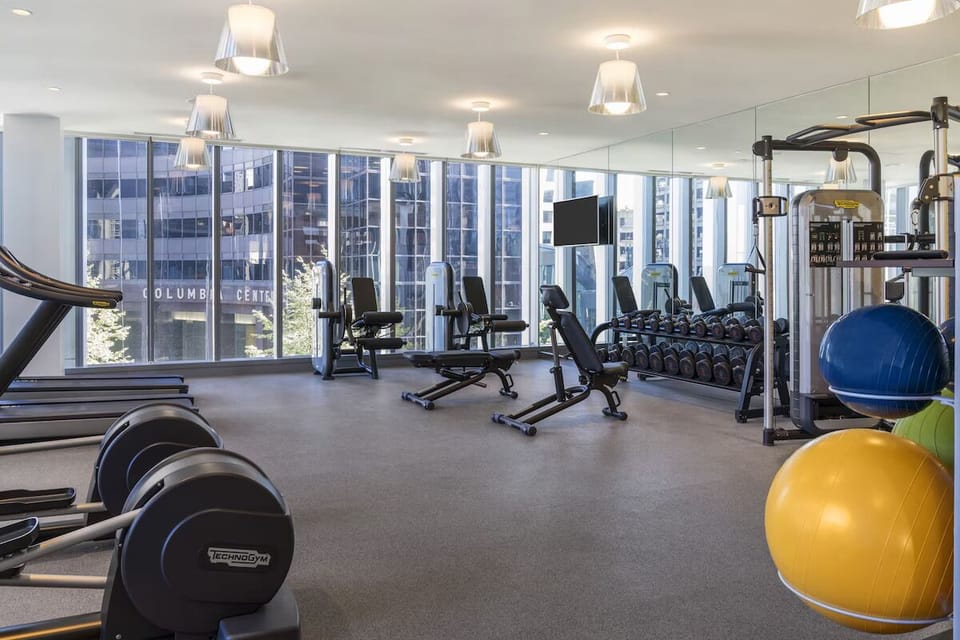 Energize your day in a bright gym with city views.