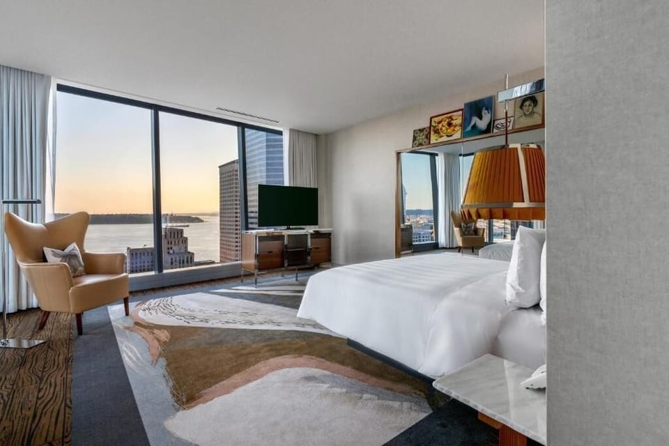 Wake to sweeping water views from a cloud-soft king bed.