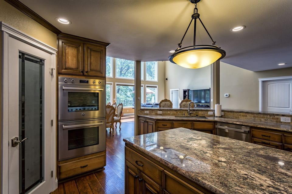 Kitchen view of the Great Room and Large windows overlooking the lake!